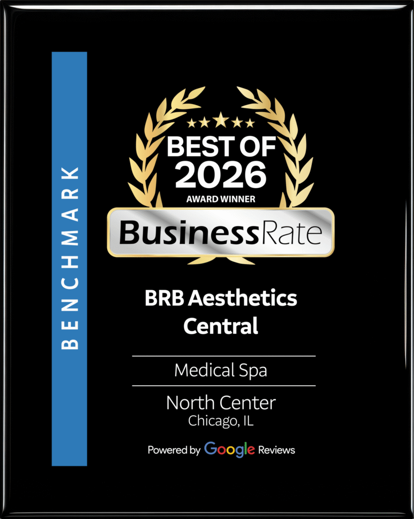 A representative accepts an official award plaque for BRB Aesthetics Central, celebrating excellence in Chicago medical spa services.